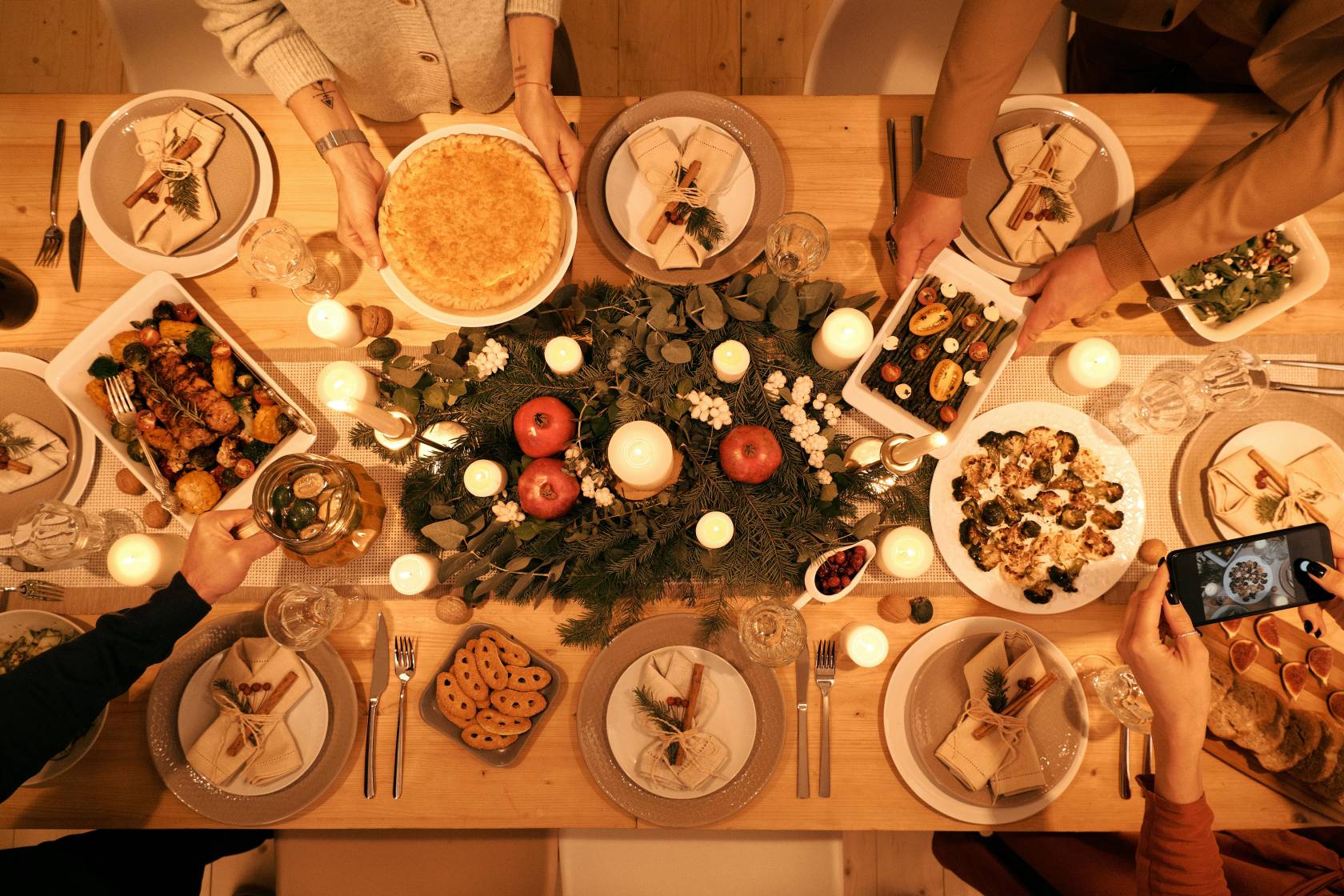 Seasonal Instagram content with various plates on a wooden table with food and dishware.